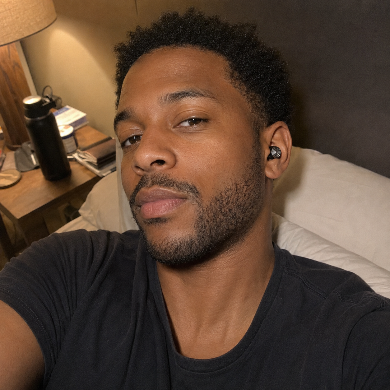 Customer wearing Driftwell earplugs while relaxing