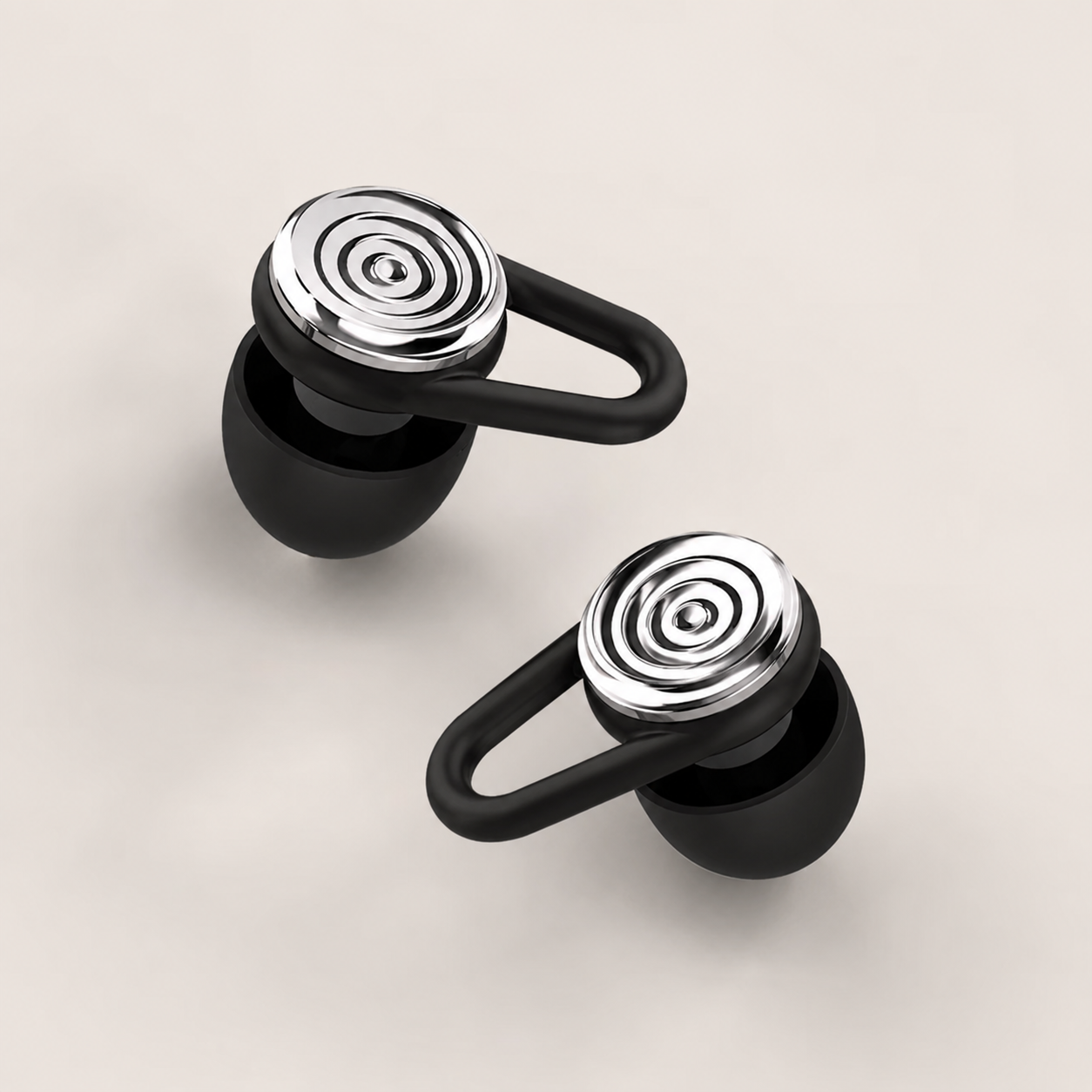 Pair of black Driftwell earplugs with polished silver acoustic filters